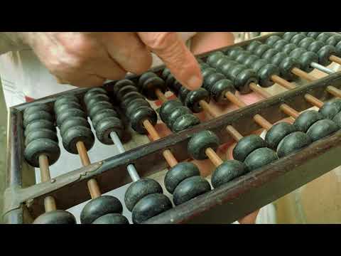 Free Stock Footage - The senior using old wooden antique calculator or Chinese abacus