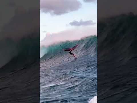 Wing foiling a crazy massive wave! 😱🤯