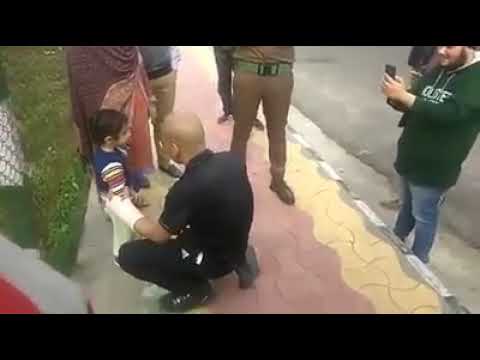 Basant Rath giving chocolates to a child
