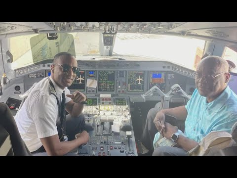 Watch pilot's emotional announcement that his father is onboard