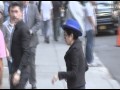 Musician and peace activist Yoko Ono blows a kiss and waves at paparazzi as she arriv