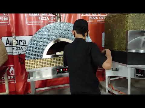 Testing the new pizza oven with a real cooking test before shipping to Jakarta