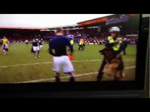 Millwall player nearly gets mauled by police dog