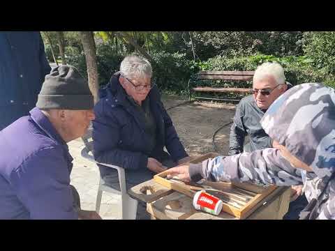 Greek pensioners playing backgammon in a park in Athens