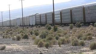 preview picture of video 'BNSF Needles sub - Autorack train at US66 near Ludlow California'
