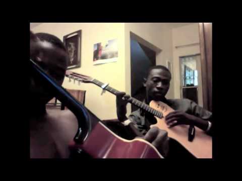 C.T. and M'BOUILLÉ Koité on the guitar