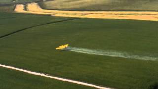 preview picture of video 'Crop dusting under a wind turbine.'