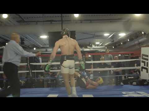 Conor McGregor drops Paulie Malignaggi with a combination.