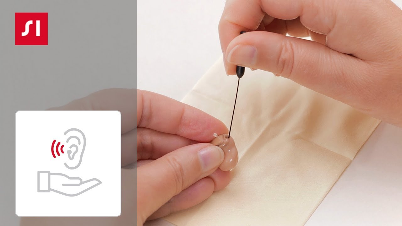 Cleaning a Signia ITE (in-the-ear) hearing aid | Signia Hearing Aids