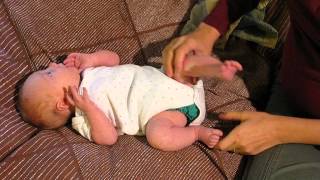 One-month-old demonstrates newborn reflexes