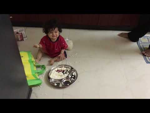 Praneel at 11 months - he is smiling at who ?