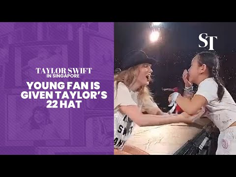 Taylor Swift in Singapore: Young fan is given Taylor's 22 hat