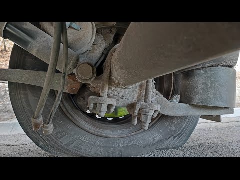 Someone welded a spring to the trailer axle! This time, Grandpa and I were completely surprised!