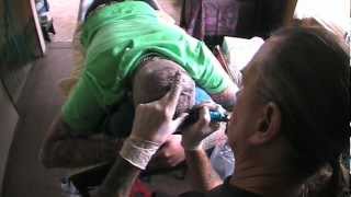 Head tattoo of the Roskopp face graphic.