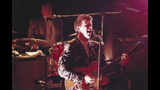 Chris Isaak and Silvertone performing Carl Perkins' "Dixie Fried" (audio from 1986 and 1995)
