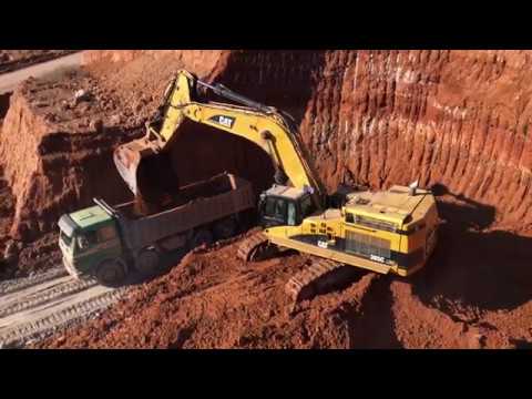Caterpillar 365C Excavator Loading Trucks With Three Passes