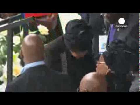 Mandela's widow Graca Machel and ex-wife Winnie's hug at memorial ceremony in Soweto
