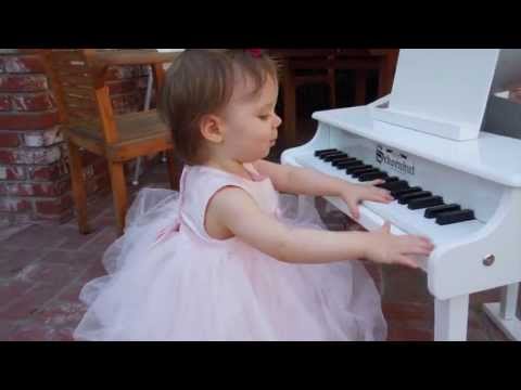 Samantha on her 1st birthday, with her birthday present - The White Grand