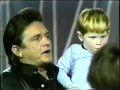 Johnny Cash sings "Jesus Loves Me" to children
