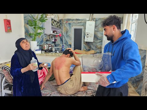 "Struggles and Hopes: Grandmother by Her Burned Son's Side"