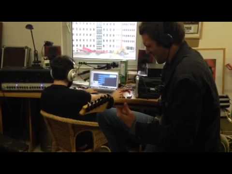Ayefore recording guitars at their homestudio