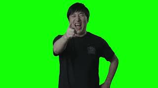 Suda 51 laughing and pointing green screen