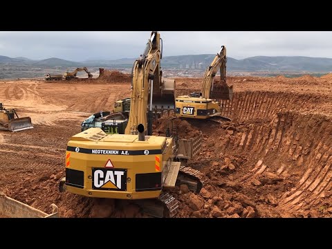 Two Caterpillar 365C Excavators Loading Trucks