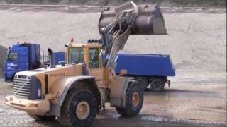 preview picture of video 'Volvo L220E Loading Volvo FH12 480 Truck And Filling The Mixing Plant'