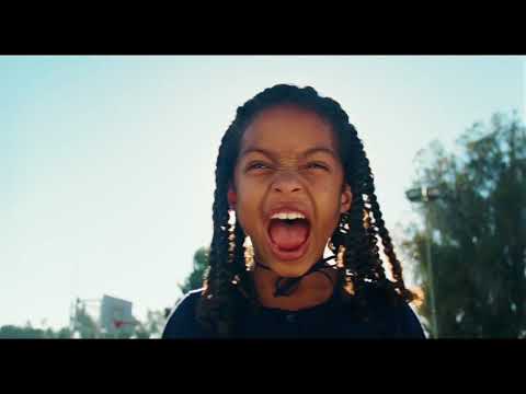 Imagine That trailer frame emphasizing a quiet father–daughter beat underscored by acoustic music