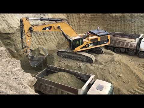 Caterpillar 385C Excavator Loading Trucks