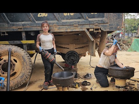 Girl mechanic restores loose truck wheel bearing