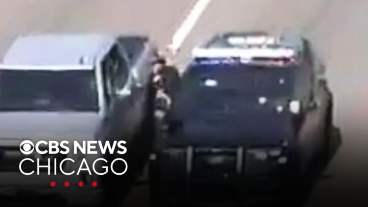 Officer climbs between 2 moving vehicles to save driver