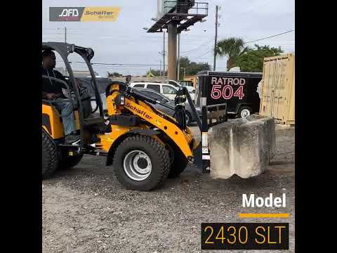 Schäffer 2430 SLT With Pallet Fork Bucket In Action