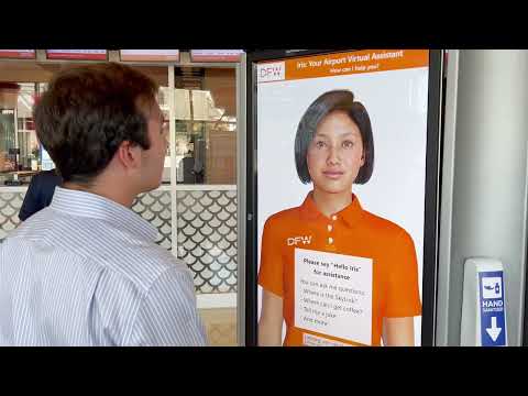 Digital Iris, an animated digital human in a DFW uniform, on an airport kiosk screen facing a traveler