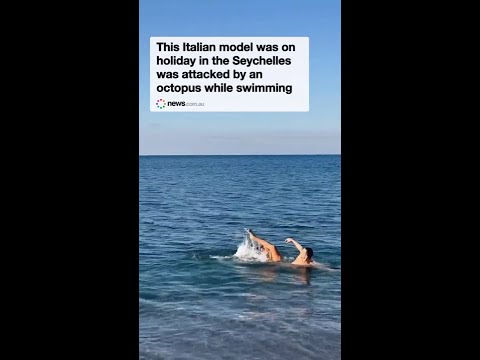 Model attacked by octopus while swimming in sea
