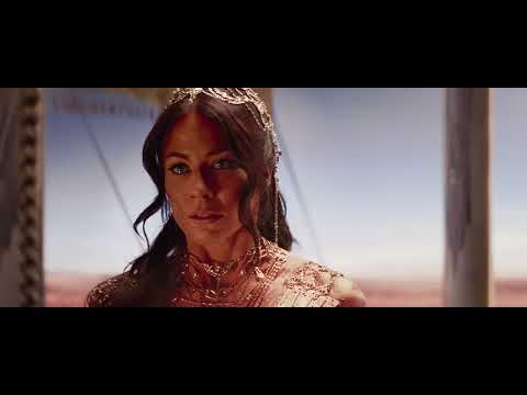 Official Disney UK trailer frame for John Carter showing Taylor Kitsch amid Martian landscape, hinting at epic orchestral scale