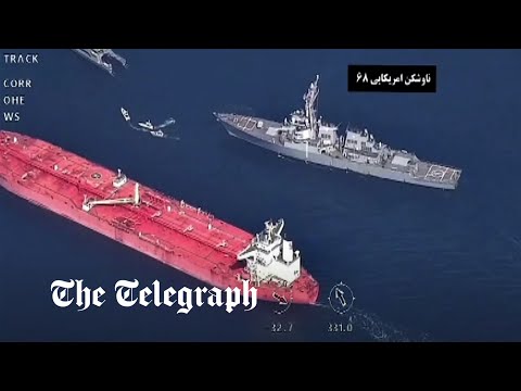 US warship and Iranian forces in stand-off over oil tanker