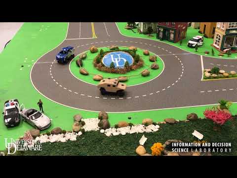 Real-Time Optimal Controller for Coordination of CAVs in a Multi-Lane Roundabout