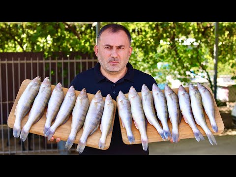 FISH with VEGGIES in a CAULDRON in the OPEN FIRE.