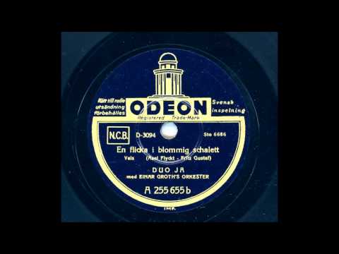 DUO JA - EN FLICKA I BLOMMIG SCHALETT