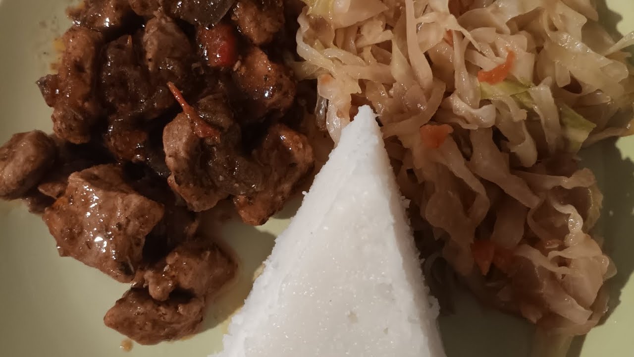 How to make Ugali served with yummy nutrient-dense beef stew and cabbage. 