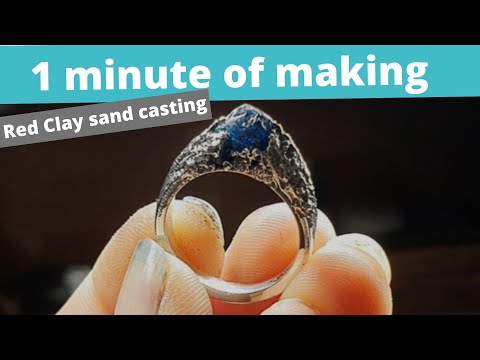 Sand casting - Red Clay - cast in place rough sapphire