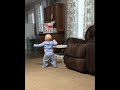 Baby slips and falls while learning to walk