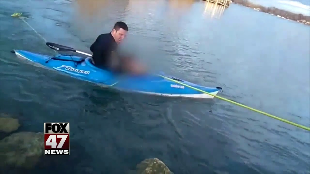 Police sergeant in kayak saves woman from sinking car in Detroit River