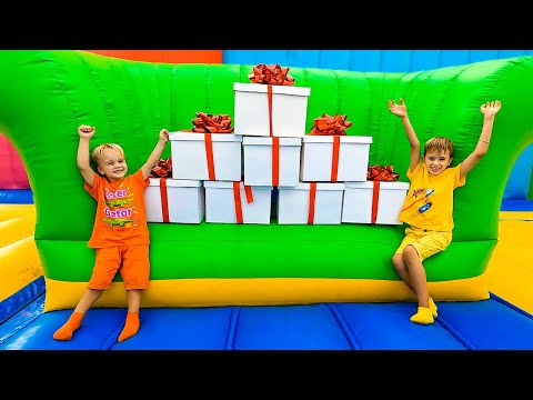 Niki and Chris Surprises Box Challenge in inflatable castle