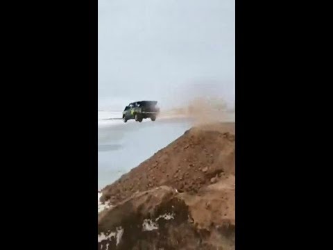 Slav drives car into frozen lake at full speed