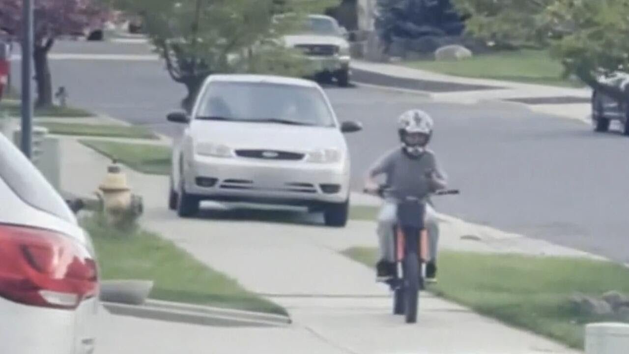 Driver accused of chasing child on bike down a sidewalk before attempting to break into a home