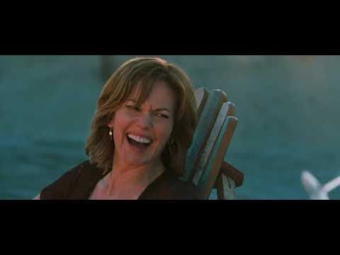 Trailer montage: wind tosses curtains; a record spins; the couple smiles in candlelight as thunder rolls