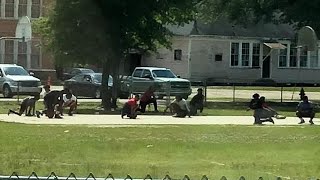 Teens Stop Pickup Basketball Game to Kneel for Passing Funeral Procession
