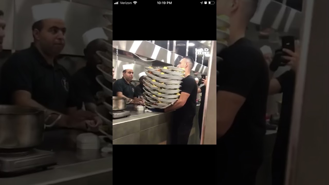 Waiter carry’s 33 plates